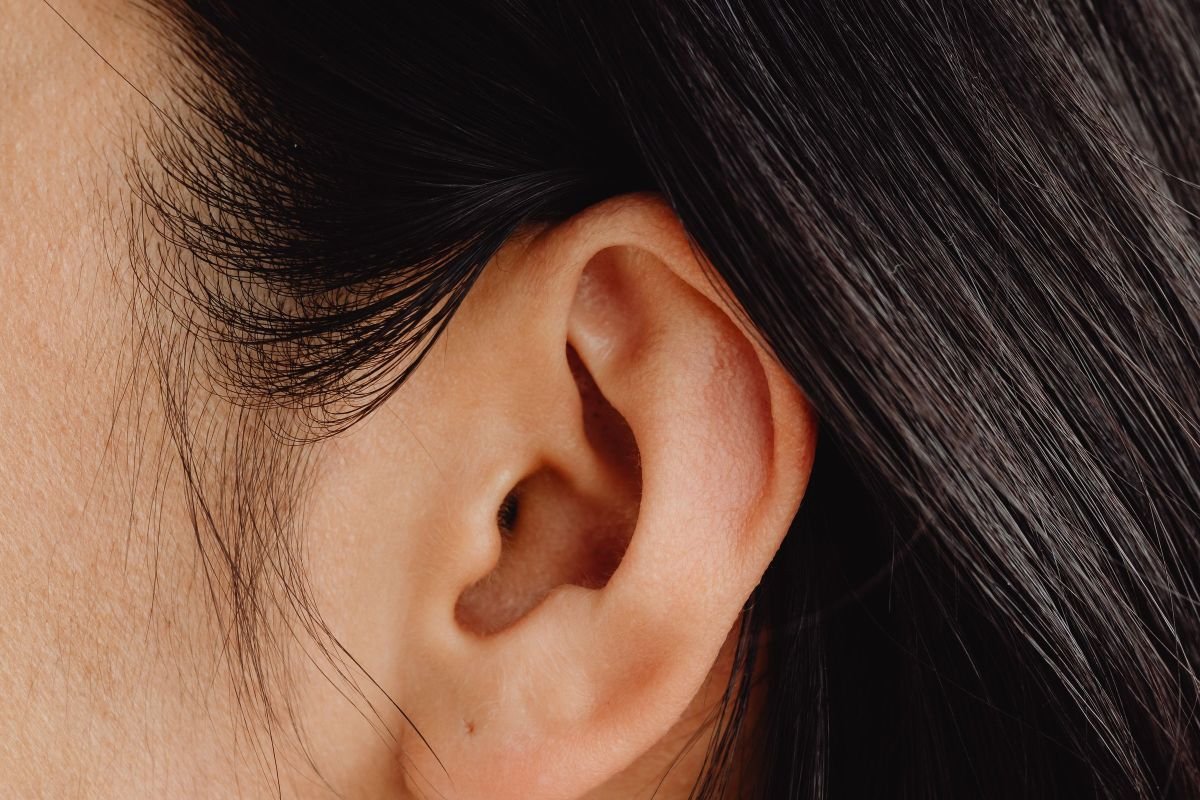 Close-up of a person's ear, representing focused listening