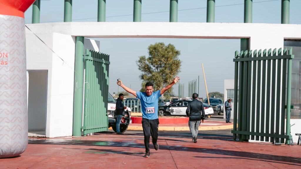 Athlete triumphantly crossing the finish line during an outdoor marathon