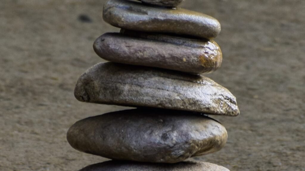 A balanced pile of smooth stones creating a serene scene