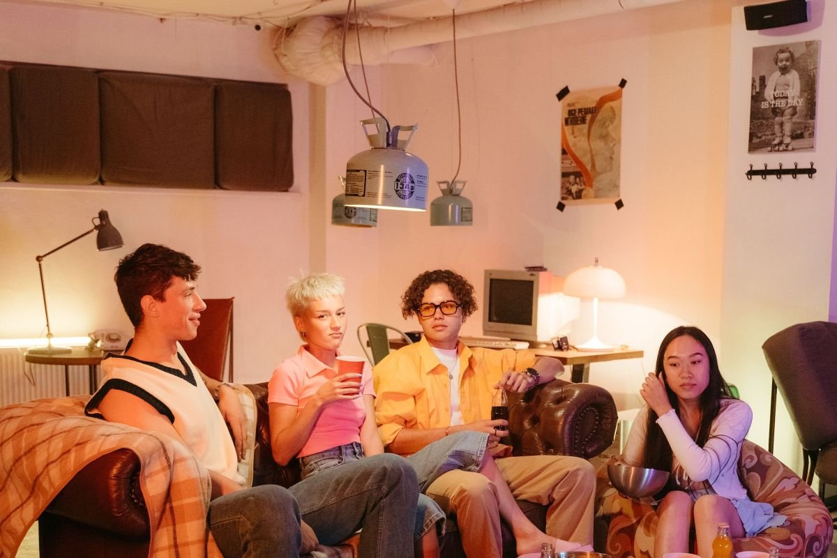 A group of friends sitting together in a living room, offering support