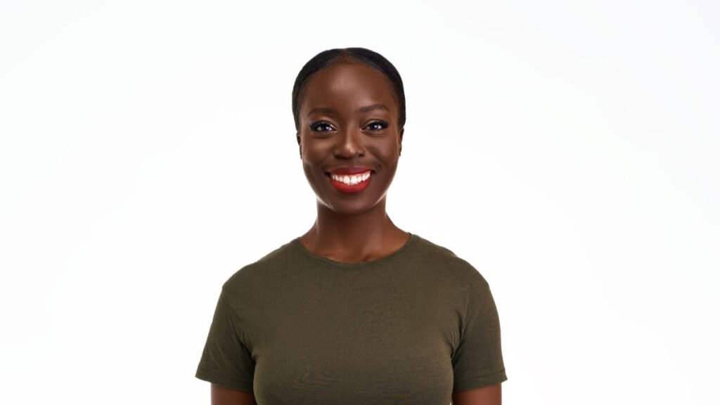 Confident woman smiling genuinely in casual attire