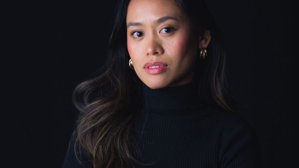 Confident businesswoman in a professional portrait, representing overcoming self-doubt