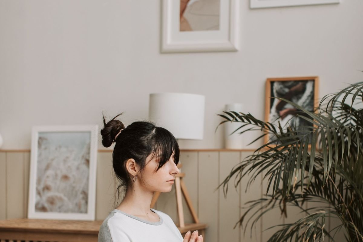 Woman meditating calmly at home, illustrating genuine mindfulness practice