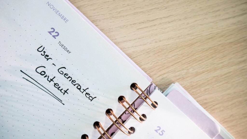 Open planner showing handwritten notes on a wooden desk