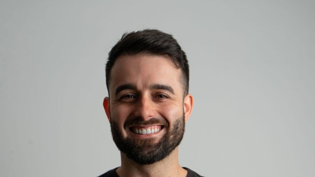 Smiling man in a professional portrait, radiating confidence