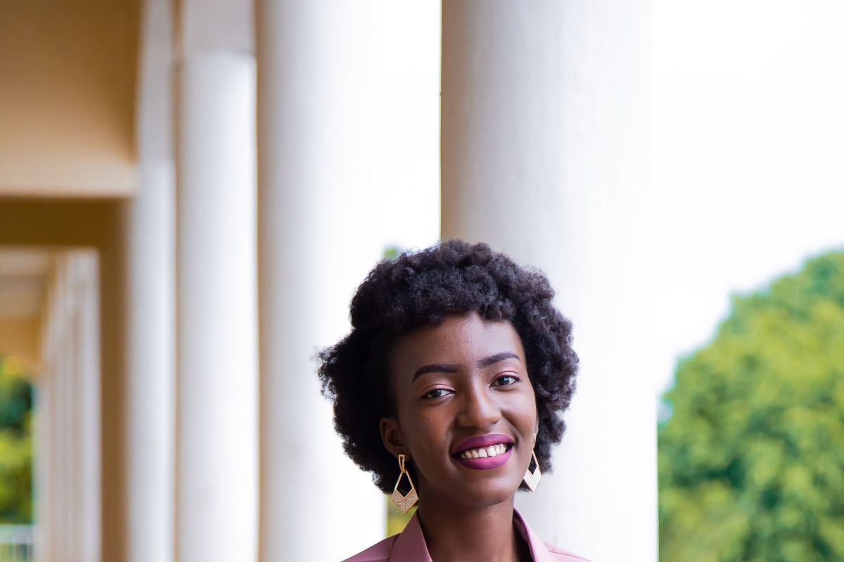 Confident smiling businesswoman standing in a corridor
