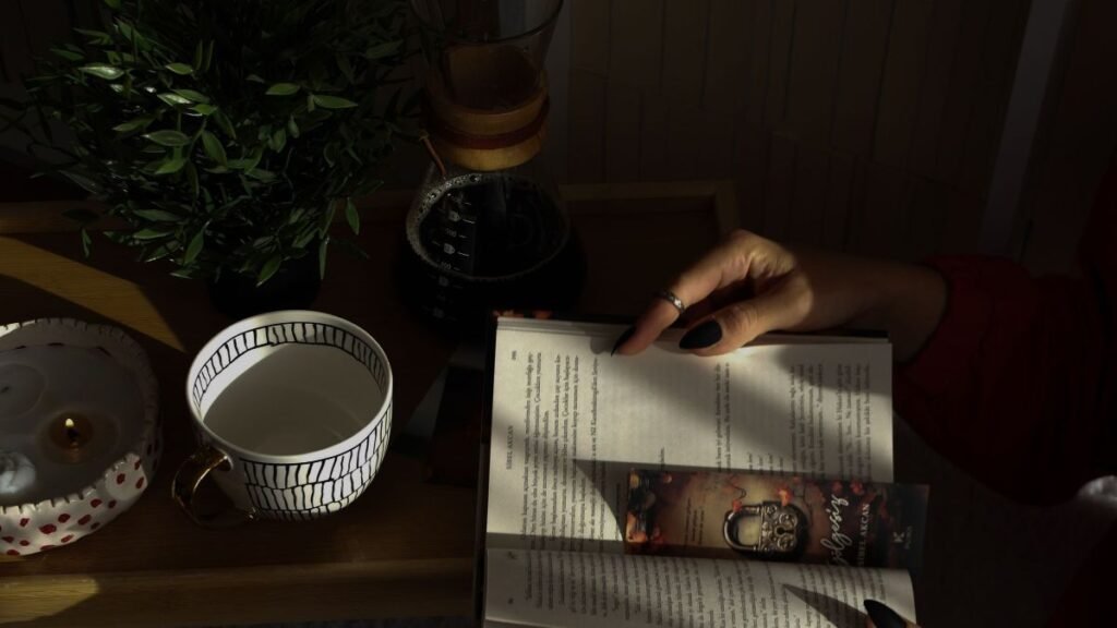 A cozy reading nook with a book and cup of tea, evoking calm