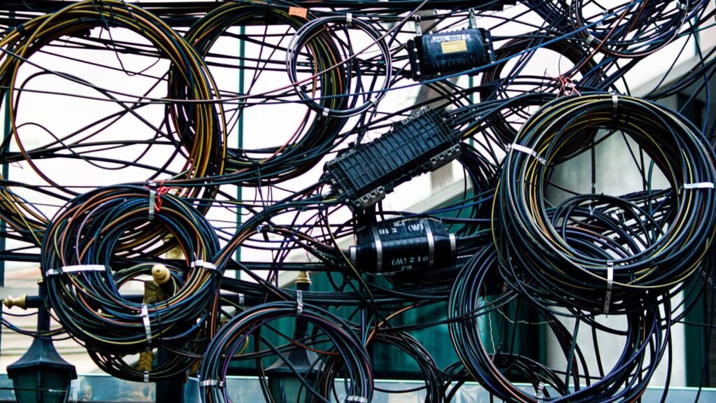 Intricate network of tangled wires outdoors