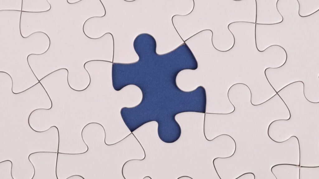 Close-up of a jigsaw puzzle with a missing piece