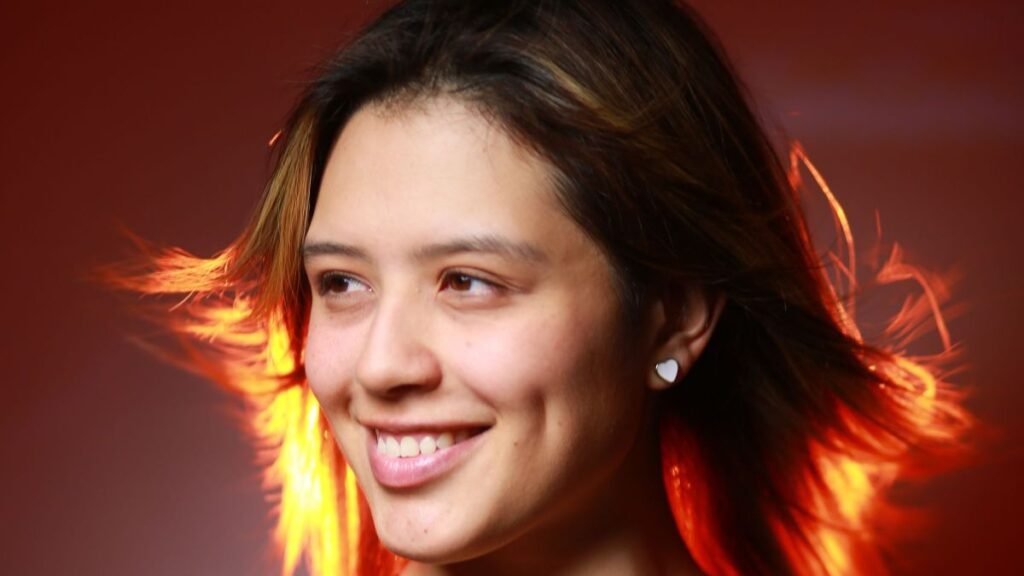 Confident Latina woman smiling warmly in a portrait