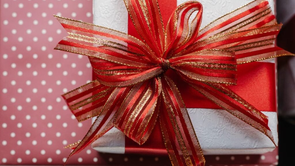 Beautifully wrapped gift boxes with red ribbons